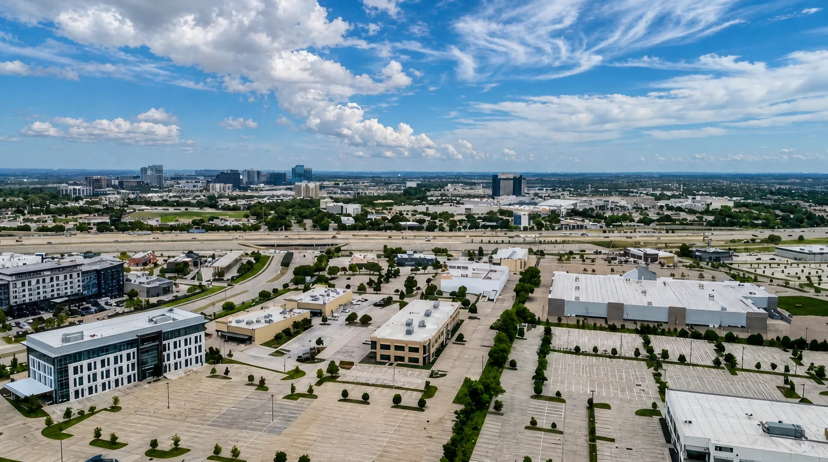 Aerial view over 8454 Parkwood looking toward the Legacy corridor skyline