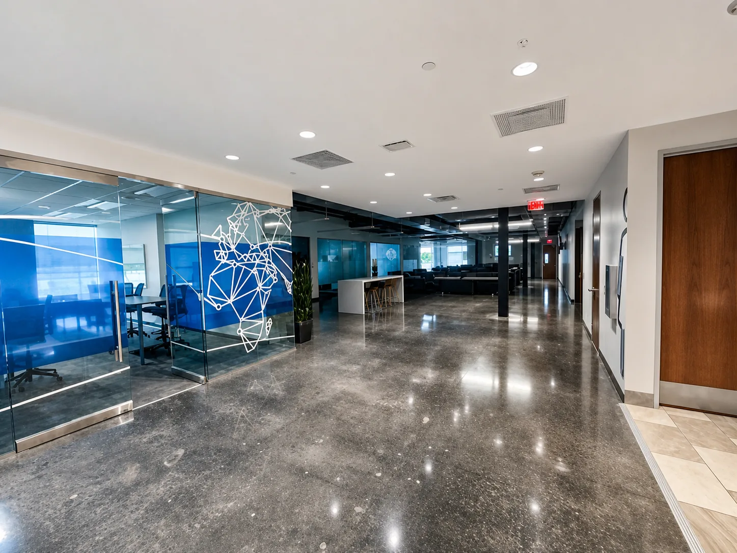 Glass-walled offices along the open first floor