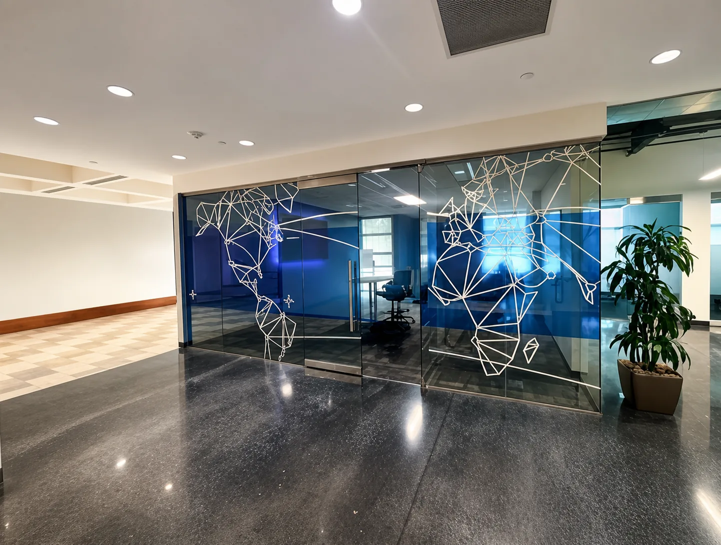 Glass-fronted meeting rooms on the first floor